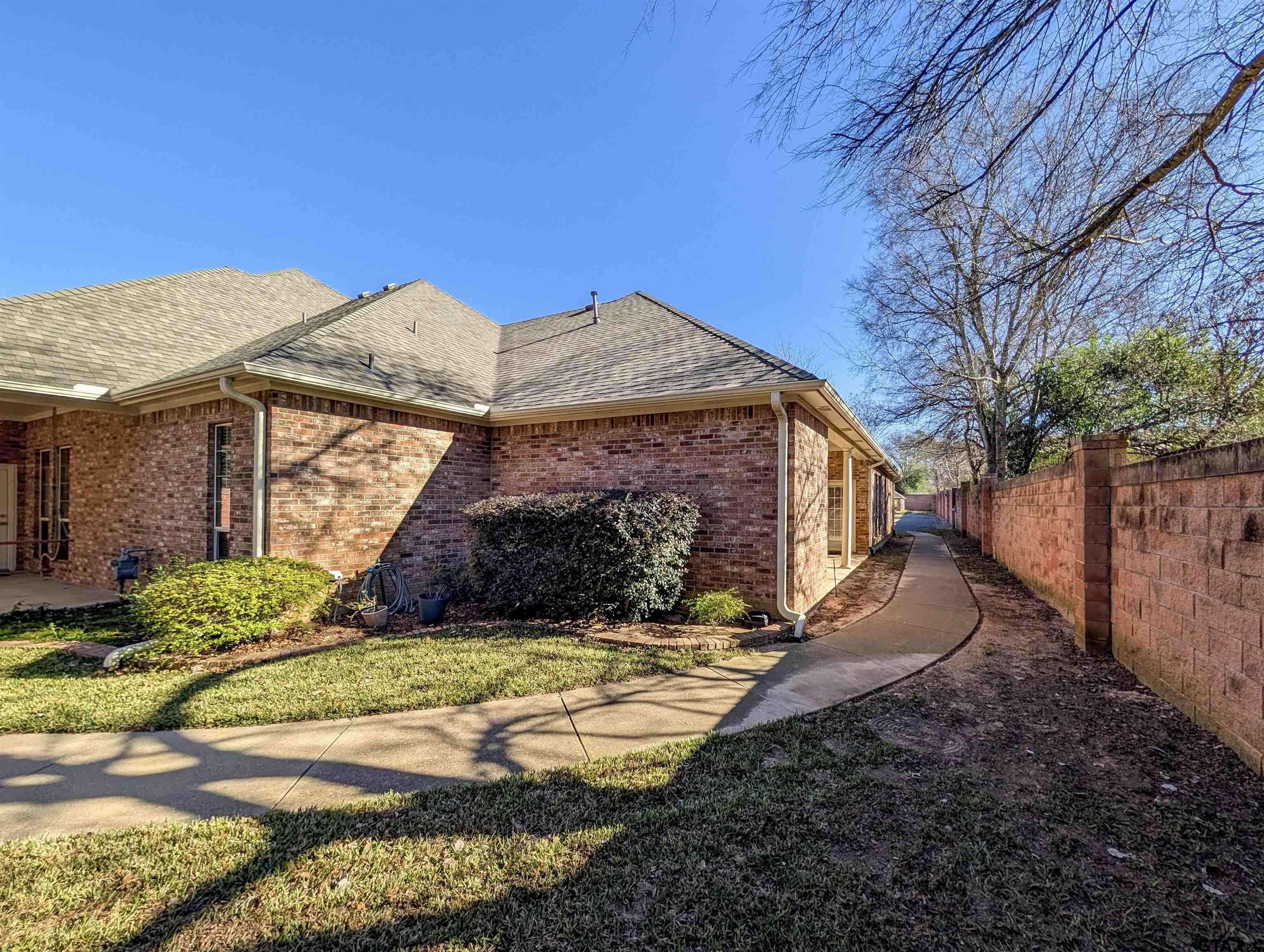 2435 Homestead Lane Tyler, TX 75701 - Photo 29 of 35 a view of a house with a yard