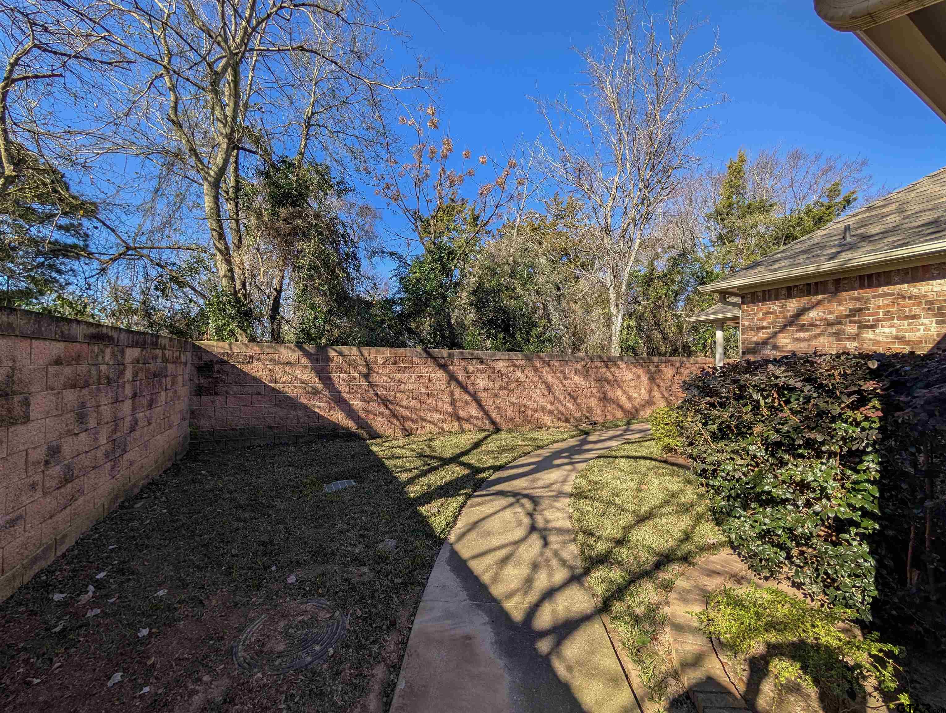 2435 Homestead Lane Tyler, TX 75701 - Photo 30 of 35 a view of an outdoor space and a yard