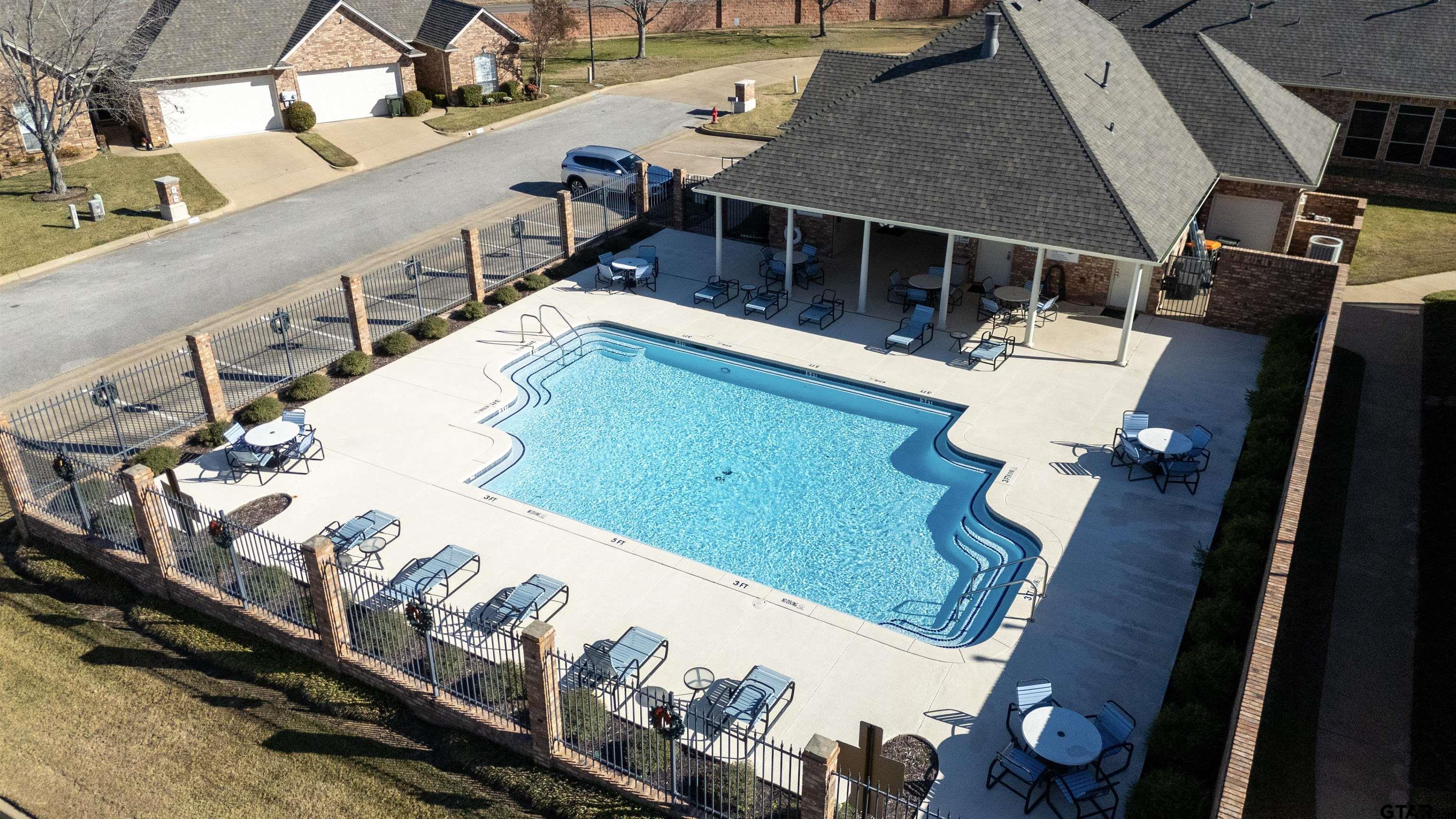 2435 Homestead Lane Tyler, TX 75701 - Photo 34 of 35 an aerial view of a house with swimming pool