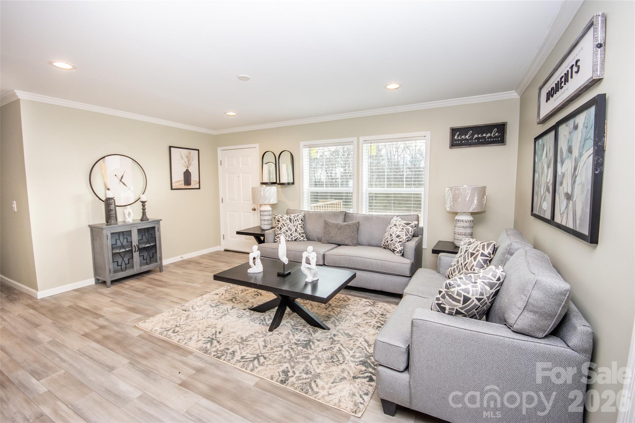 489 Eagle Mills Road Hamptonville, NC 27020 - Photo 2 of 24 a living room with furniture and a large window