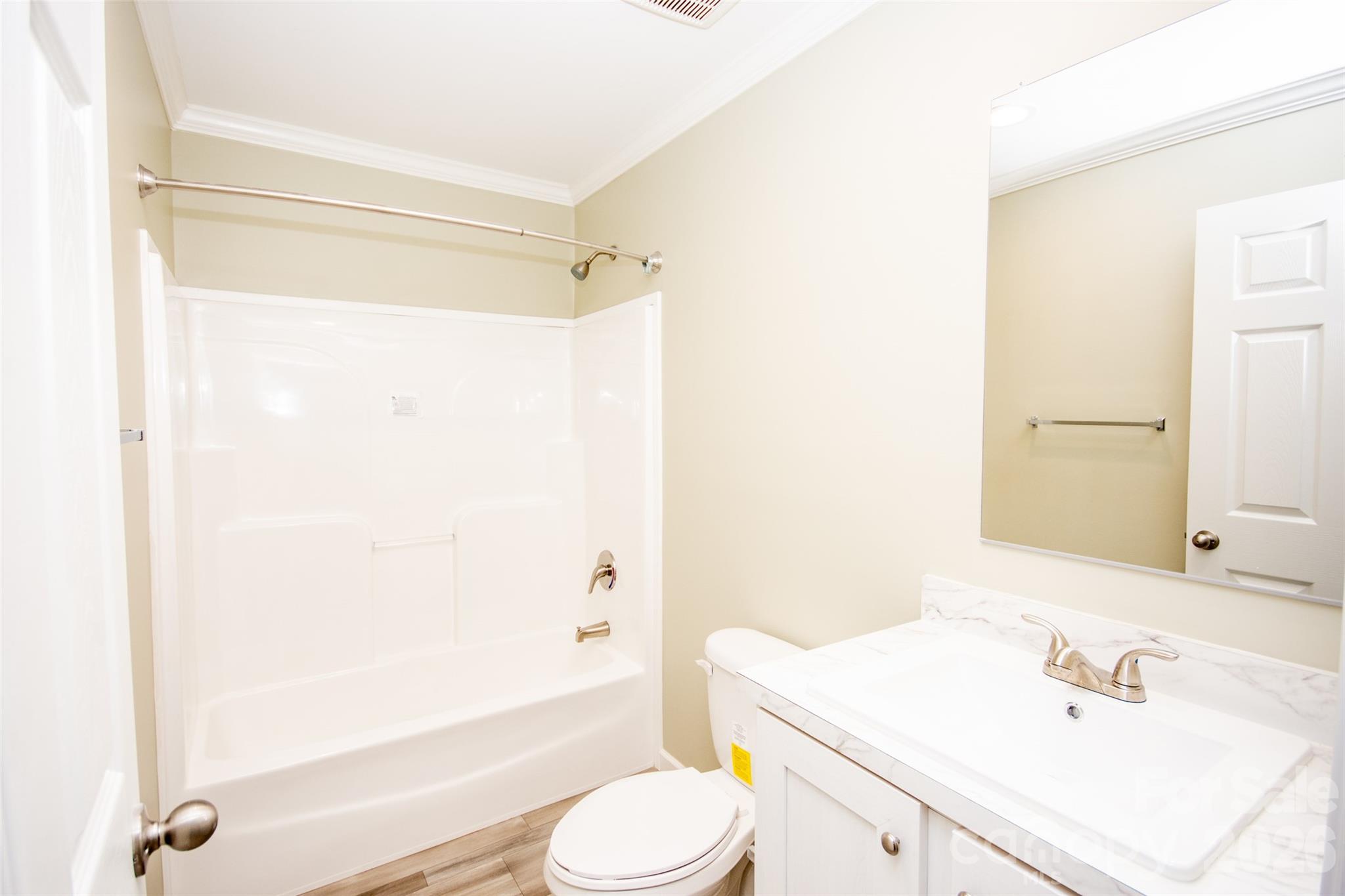 489 Eagle Mills Road Hamptonville, NC 27020 - Photo 22 of 24 a bathroom with a sink toilet and shower