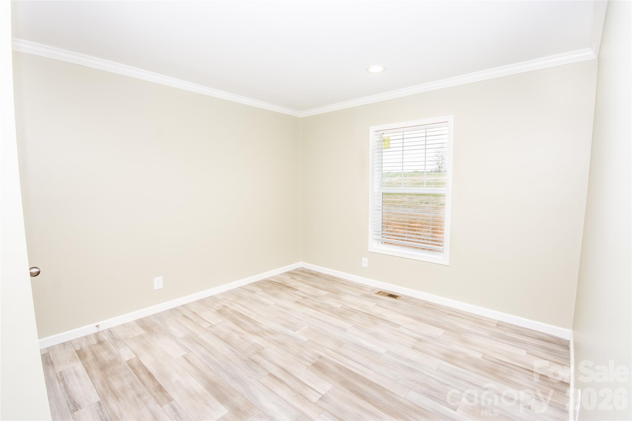 489 Eagle Mills Road Hamptonville, NC 27020 - Photo 23 of 24 a view of an empty room with a window