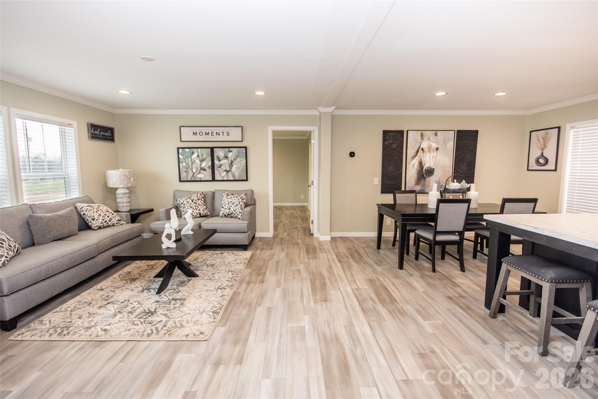 489 Eagle Mills Road Hamptonville, NC 27020 - Photo 3 of 24 a living room with furniture and a wooden floor