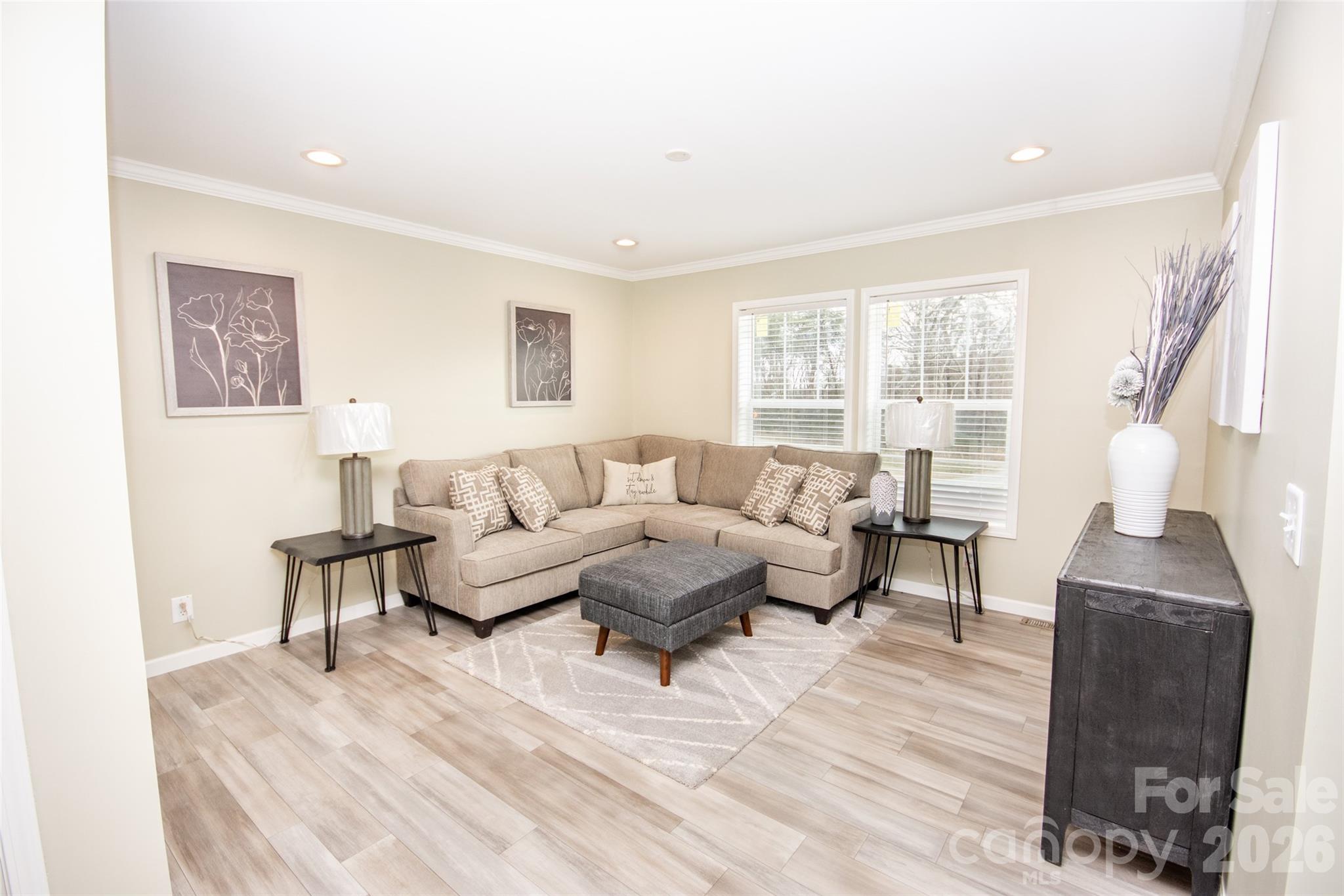 489 Eagle Mills Road Hamptonville, NC 27020 - Photo 8 of 24 a living room with furniture and a lamp