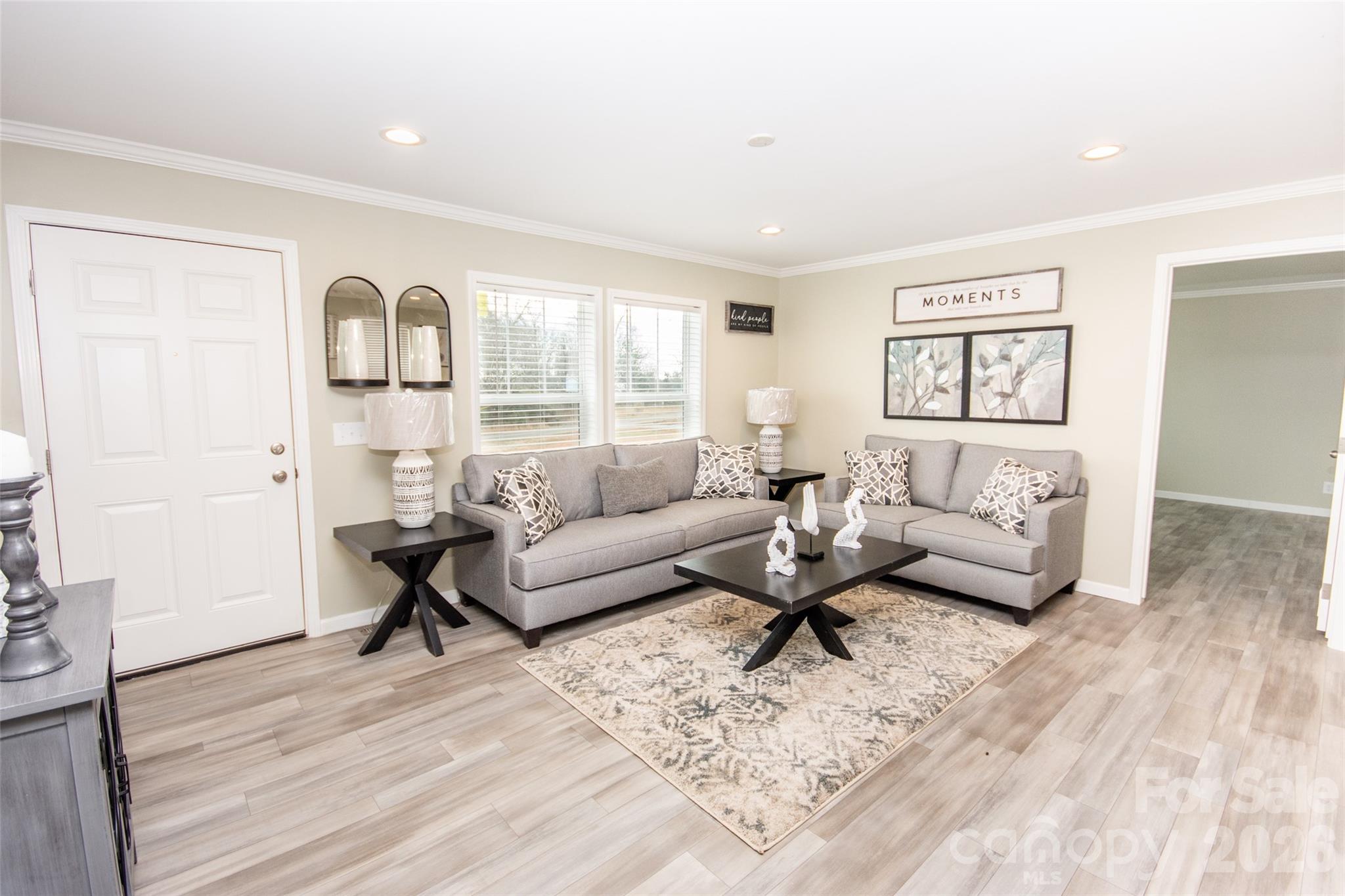 489 Eagle Mills Road Hamptonville, NC 27020 - Photo 10 of 24 a living room with furniture and wooden floor