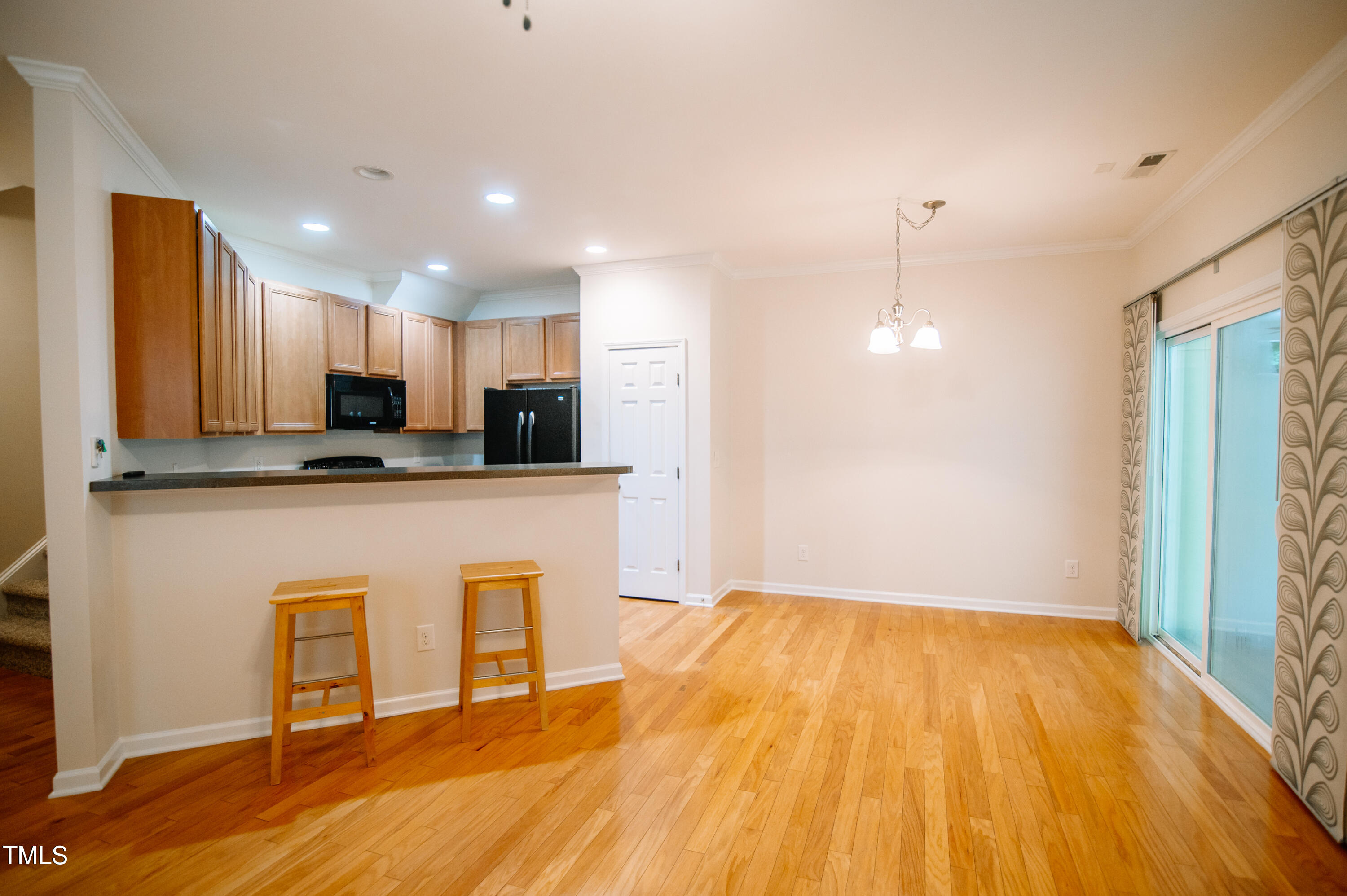 Kitchen has breakfast bar with room for additional seating