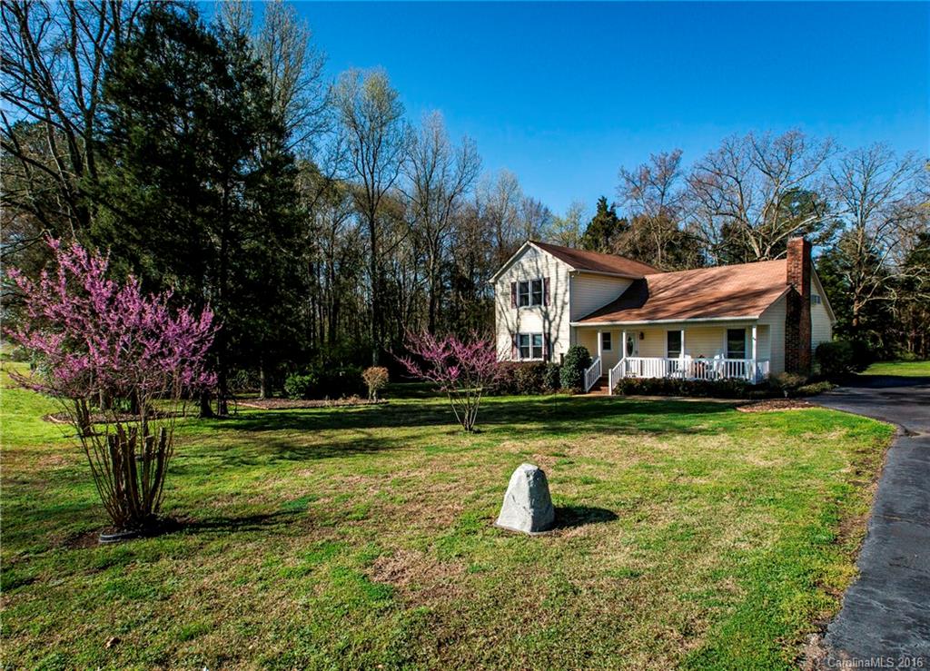 1610 Dunlap Roddey Road Rock Hill, SC 29730 - Photo 1 of 24 a front view of a house with garden and trees