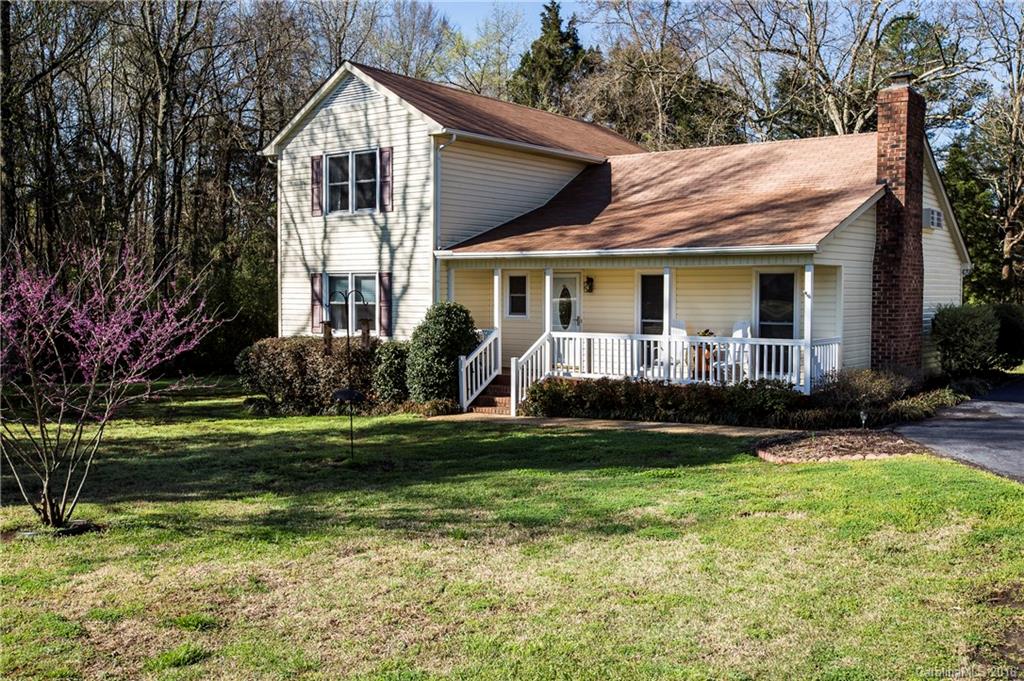 1610 Dunlap Roddey Road Rock Hill, SC 29730 - Photo 2 of 24 a front view of a house with a yard and trees