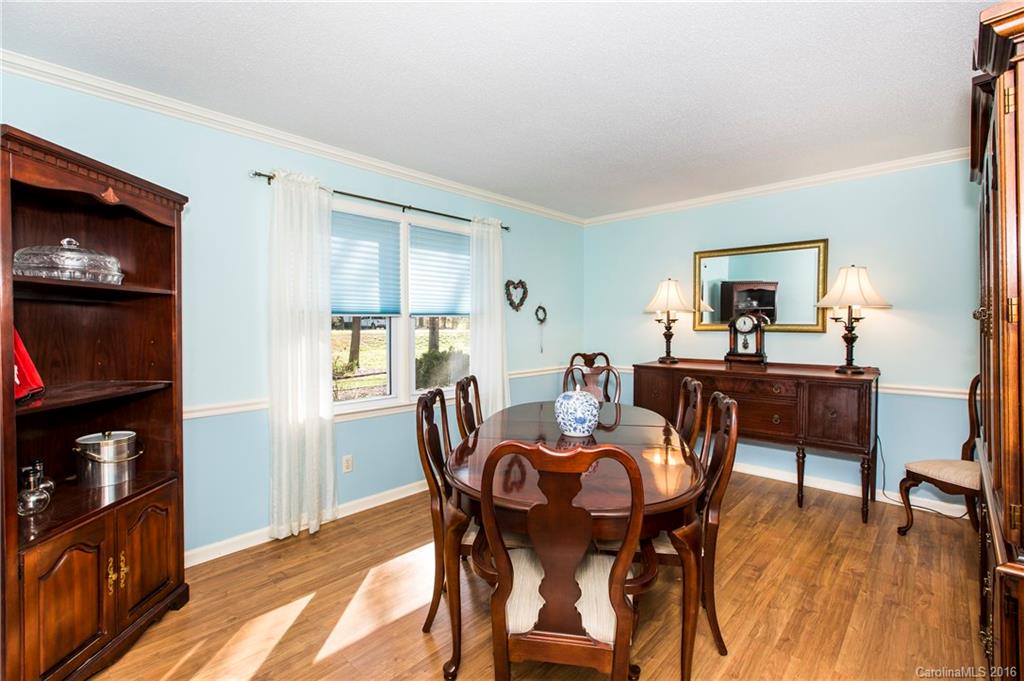 1610 Dunlap Roddey Road Rock Hill, SC 29730 - Photo 11 of 24 a view of a dining room with furniture and wooden floor
