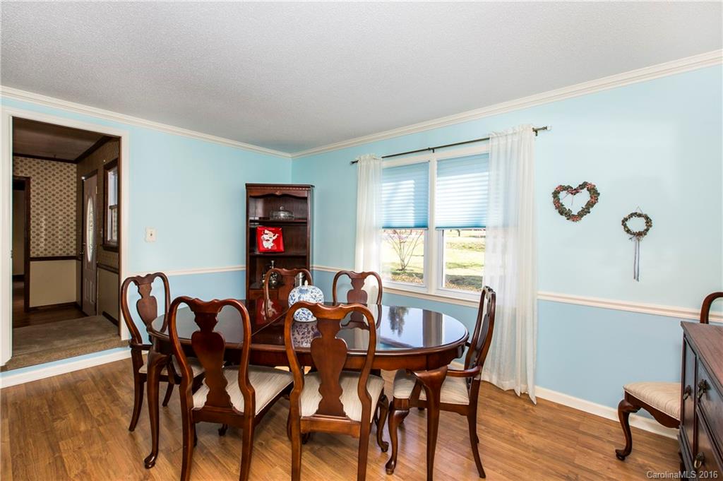 1610 Dunlap Roddey Road Rock Hill, SC 29730 - Photo 12 of 24 a view of a dining room with furniture and wooden floor