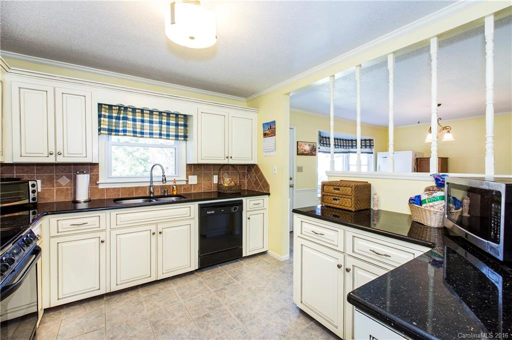 1610 Dunlap Roddey Road Rock Hill, SC 29730 - Photo 6 of 24 a kitchen with a sink stove and cabinets