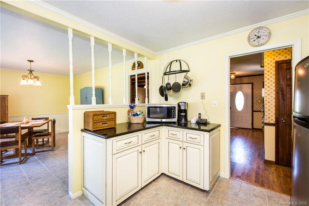 1610 Dunlap Roddey Road Rock Hill, SC 29730 - Photo 7 of 24 a kitchen with granite countertop a sink and cabinets