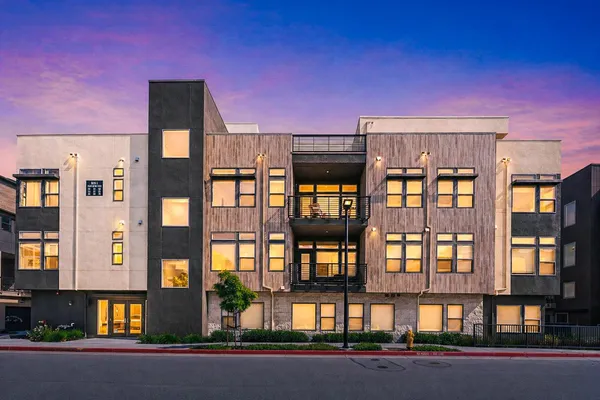 a front view of a multi story residential apartment building