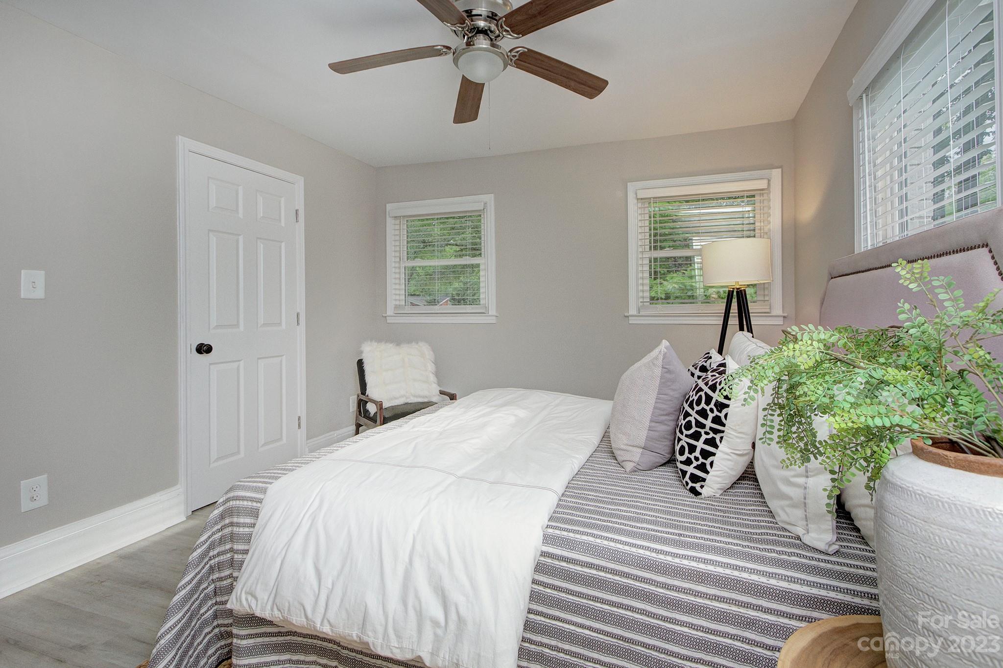 2954 Enfield Road Charlotte, NC 28205 - Photo 12 of 27 a bedroom with a bed and a window