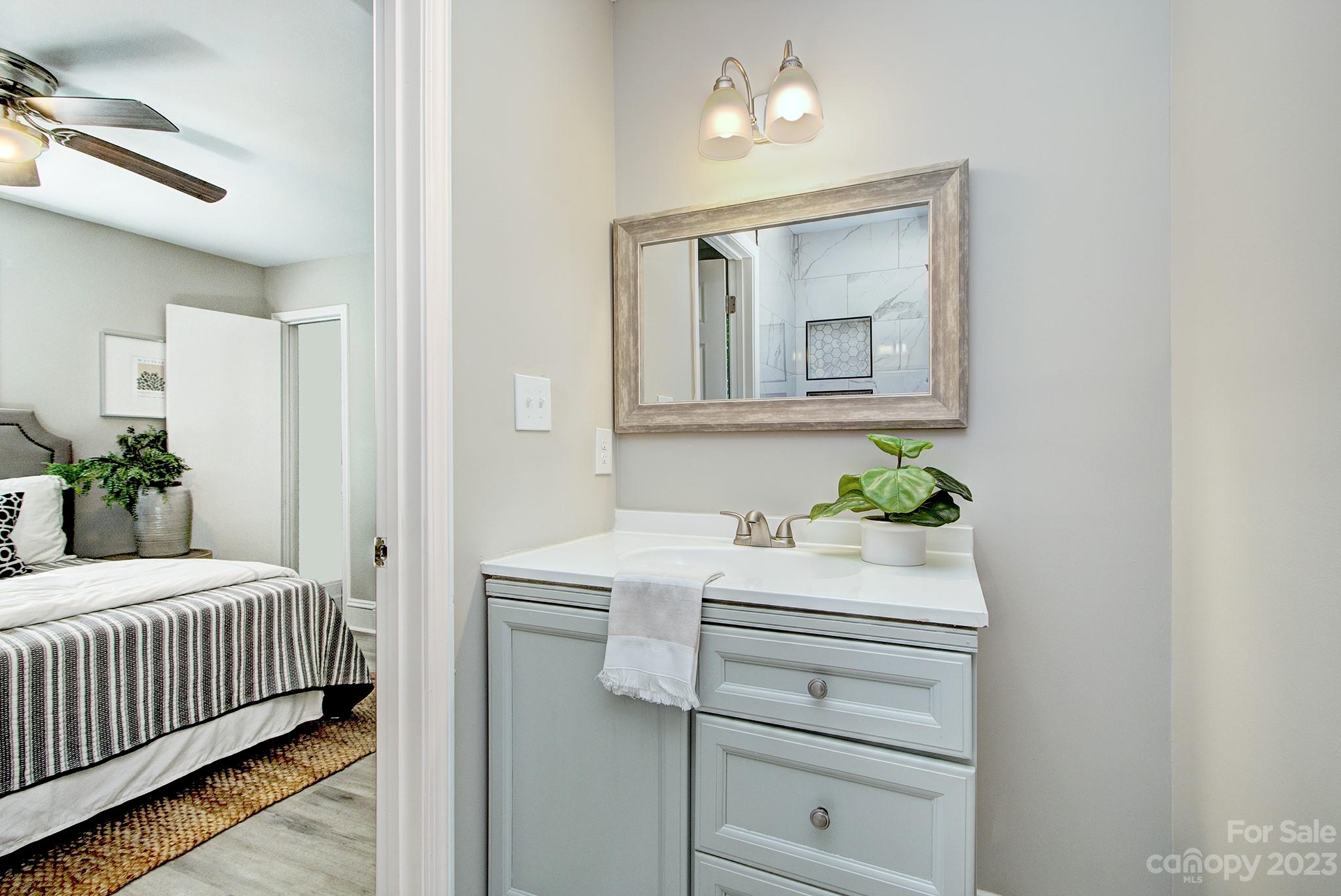 2954 Enfield Road Charlotte, NC 28205 - Photo 13 of 27 a bedroom with a bed window and mirror