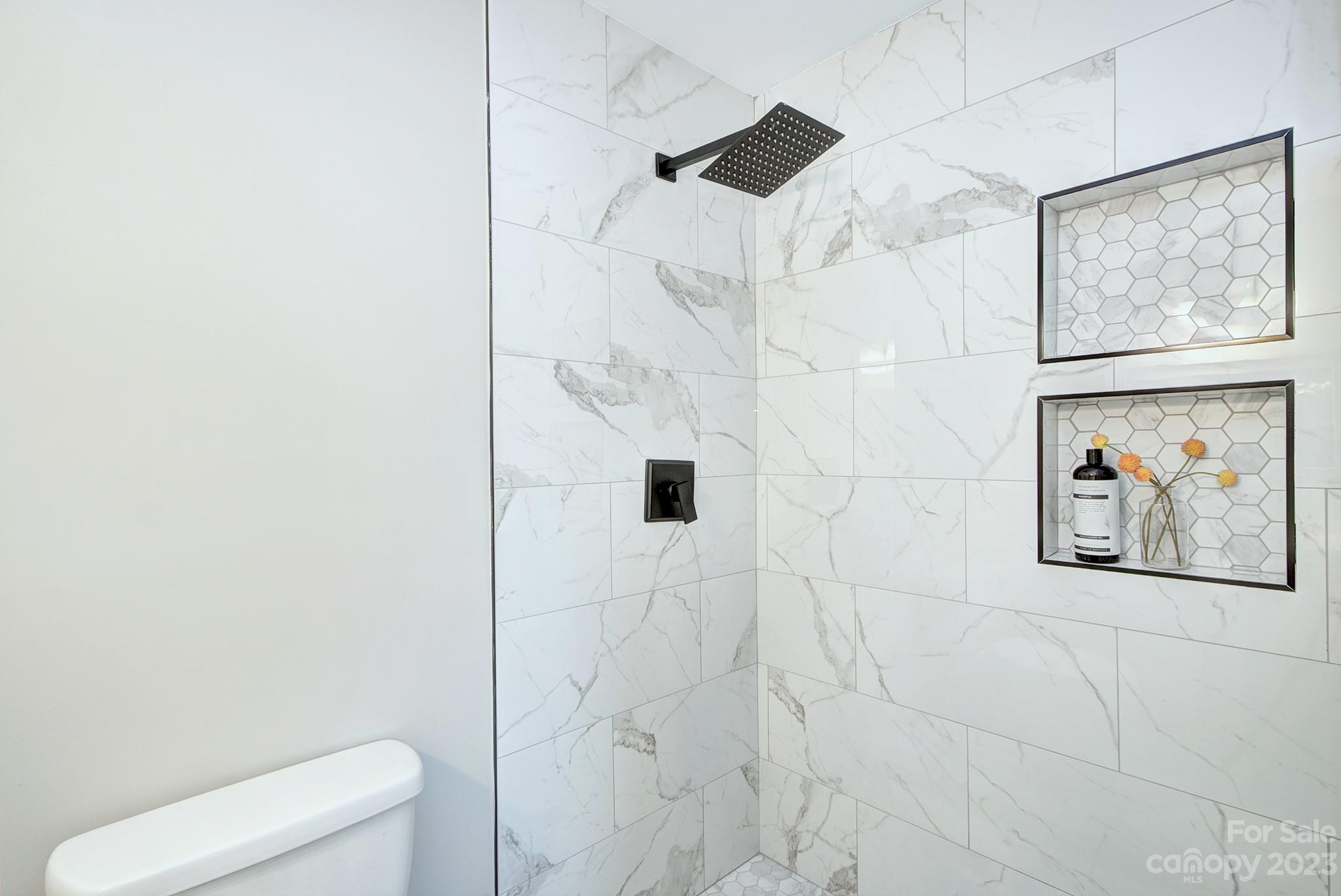 2954 Enfield Road Charlotte, NC 28205 - Photo 14 of 27 a bathroom with a shower and a toilet