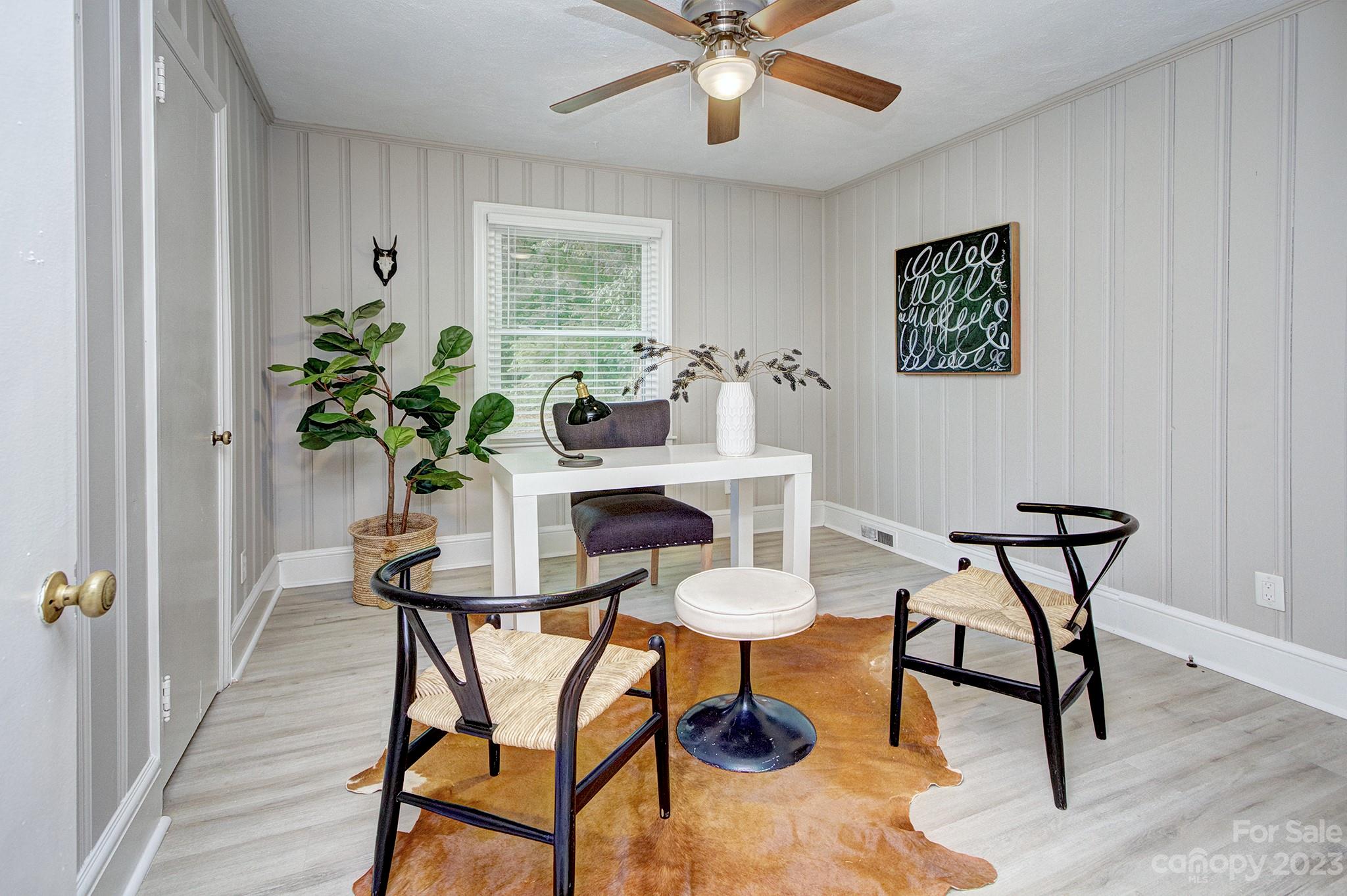 2954 Enfield Road Charlotte, NC 28205 - Photo 20 of 27 a view of a dining room with furniture and a potted plant