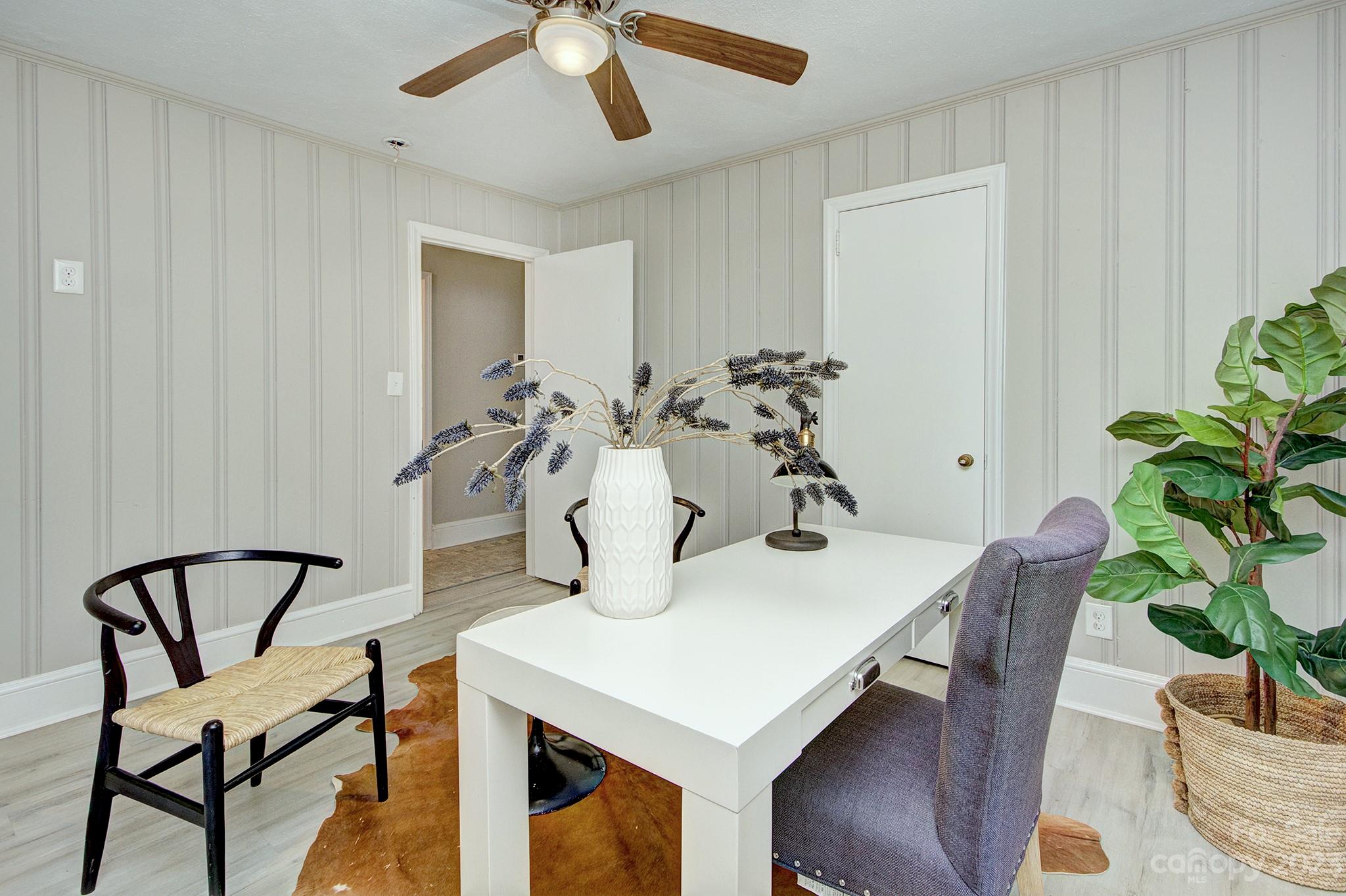 2954 Enfield Road Charlotte, NC 28205 - Photo 21 of 27 a view of a dining room with furniture and wooden floor