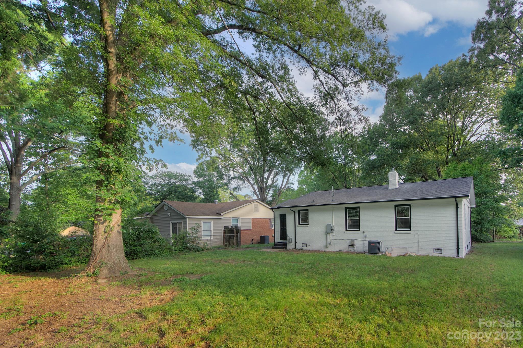 2954 Enfield Road Charlotte, NC 28205 - Photo 23 of 27 a front view of house with yard and trees
