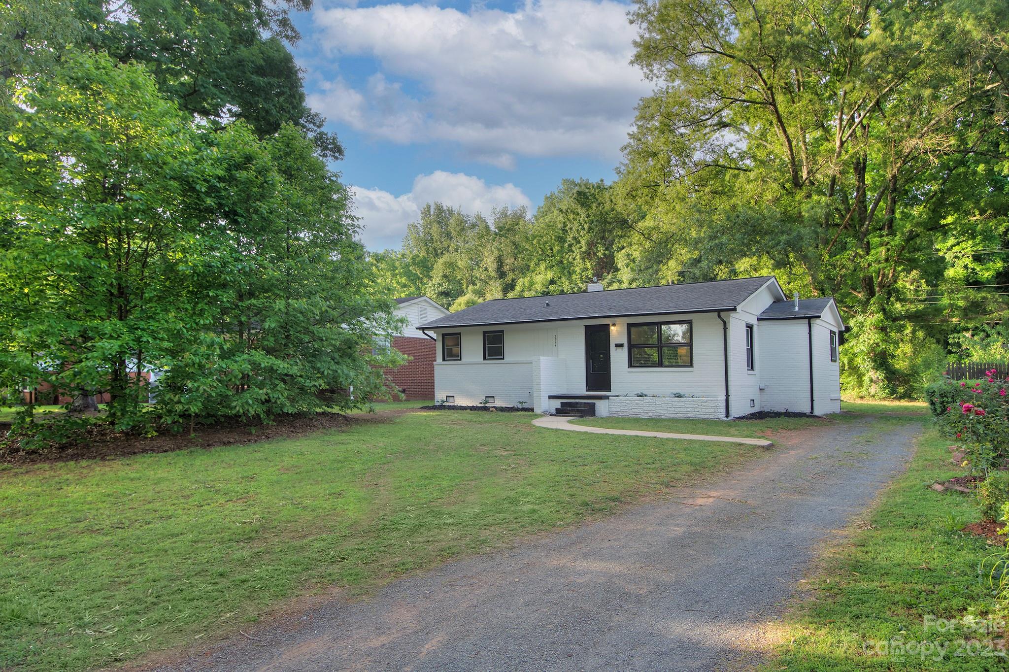 2954 Enfield Road Charlotte, NC 28205 - Photo 27 of 27 a front view of a house with a garden