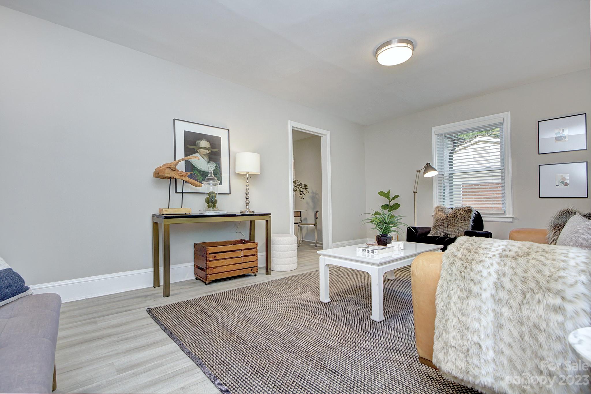 2954 Enfield Road Charlotte, NC 28205 - Photo 4 of 27 a living room with furniture and a fireplace