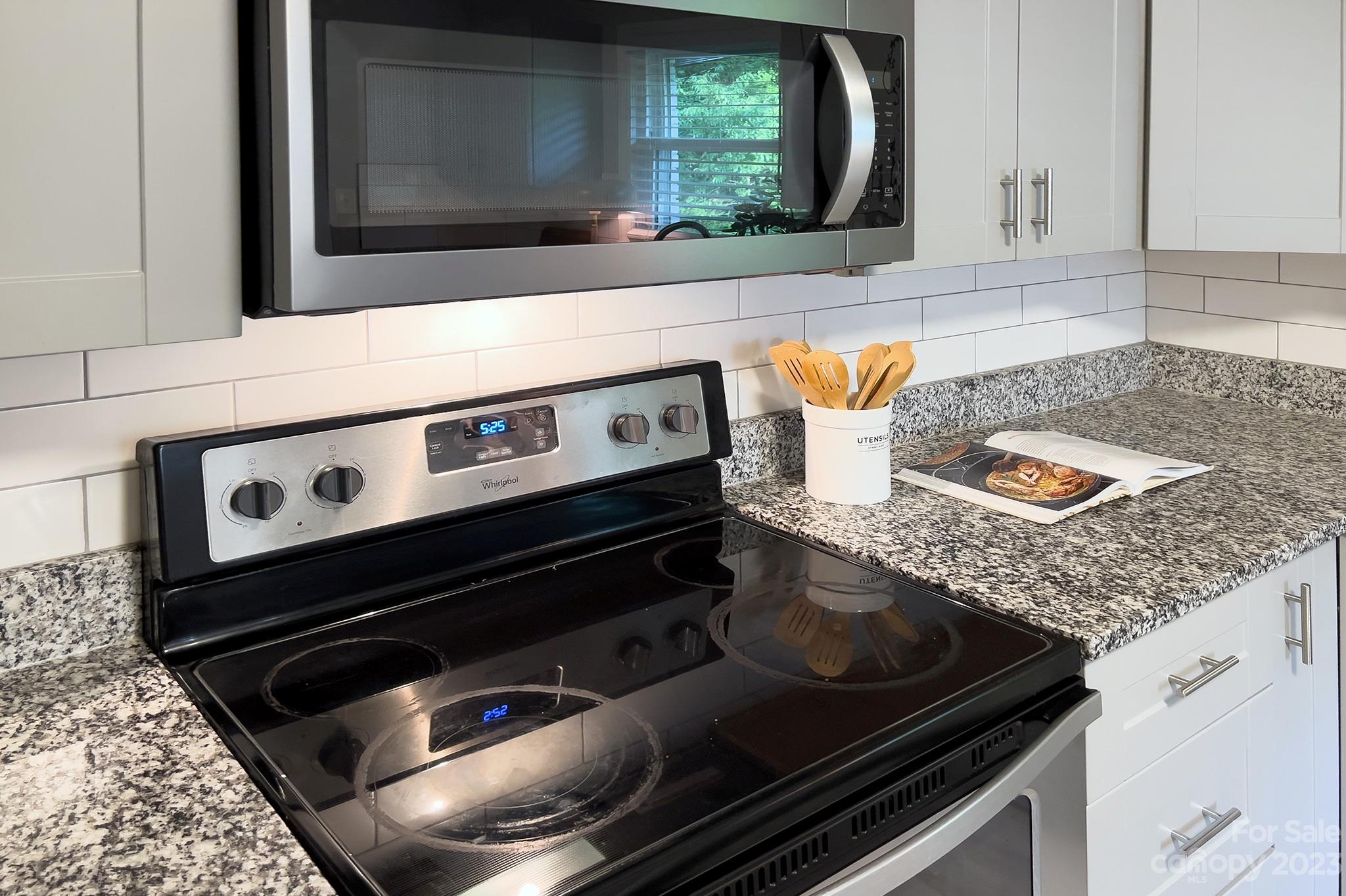 2954 Enfield Road Charlotte, NC 28205 - Photo 8 of 27 a stove top oven sitting inside of a kitchen