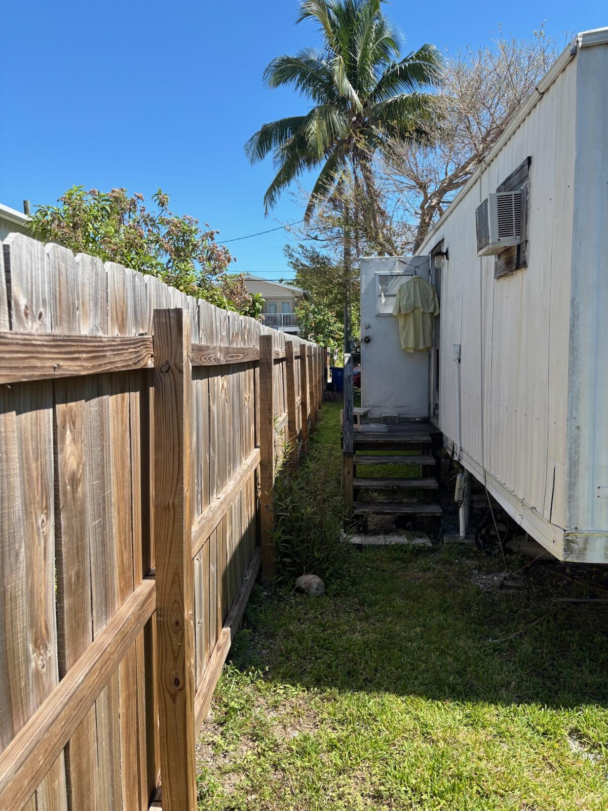 A33 8th Avenue Key West, FL 33040 - Photo 11 of 13 a view of a house with backyard and wooden fence