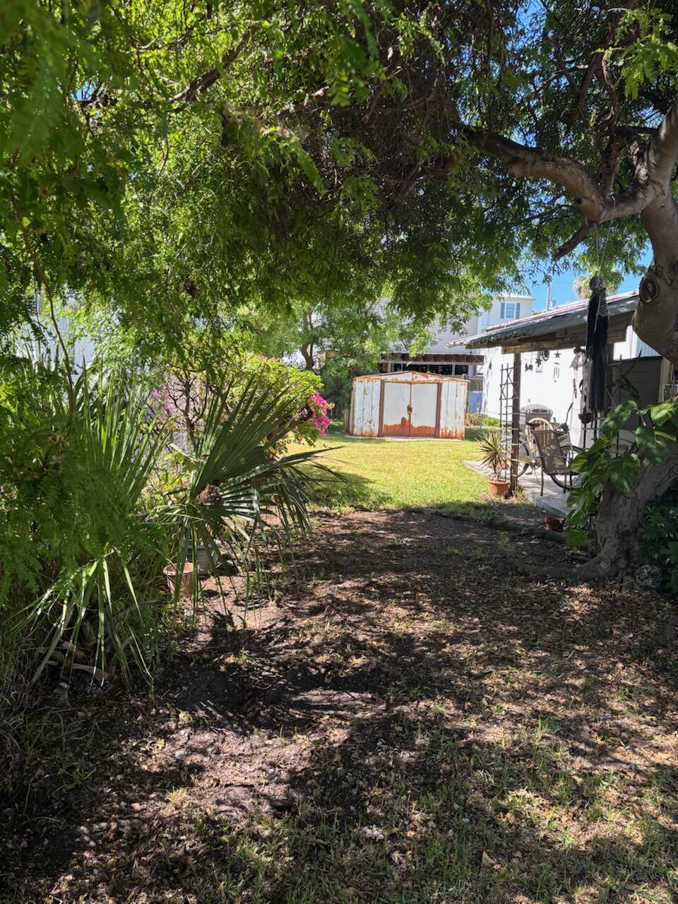 A33 8th Avenue Key West, FL 33040 - Photo 4 of 13 a view of an house with backyard and trees