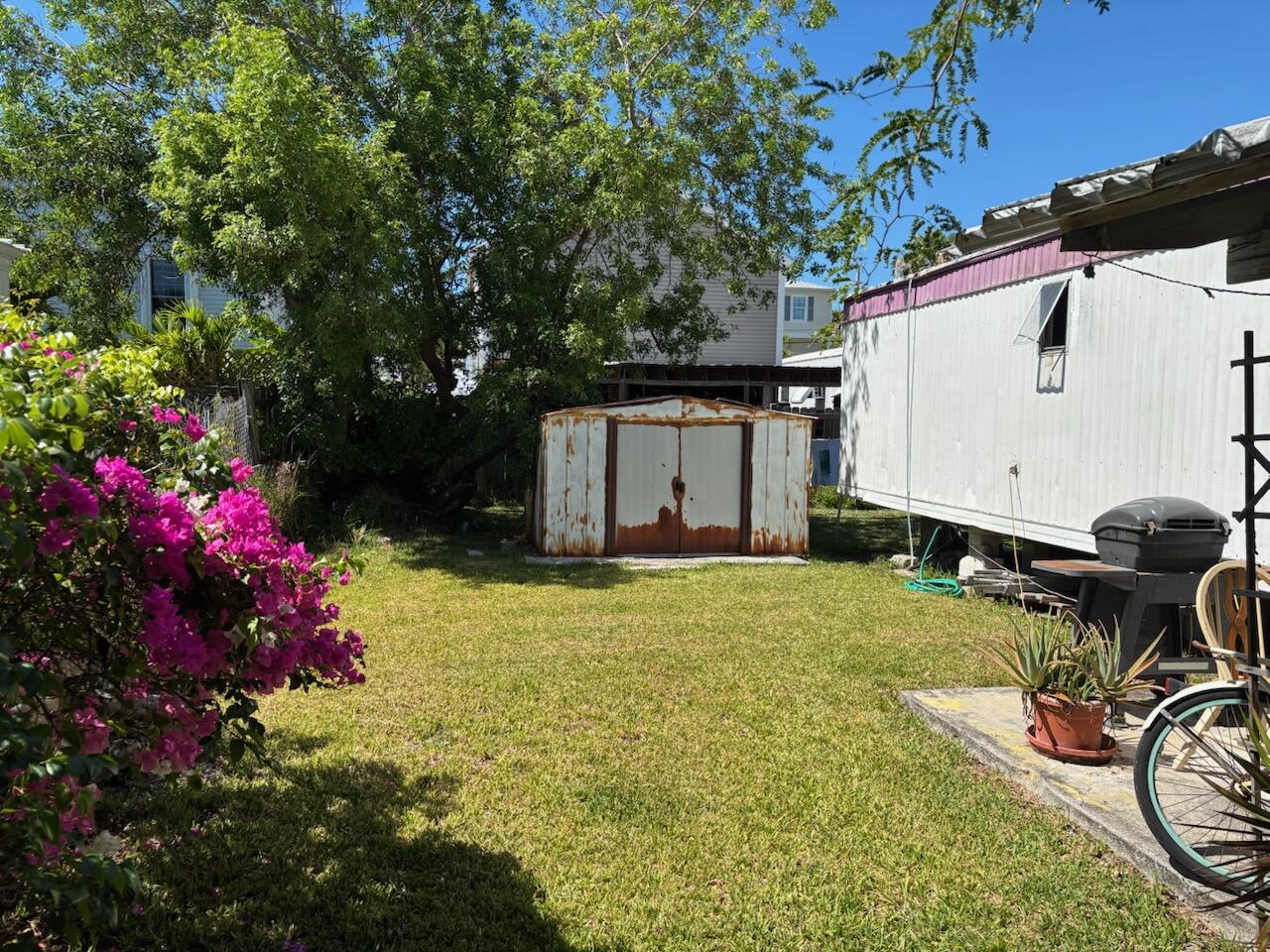 A33 8th Avenue Key West, FL 33040 - Photo 5 of 13 a view of a backyard with plants and a patio