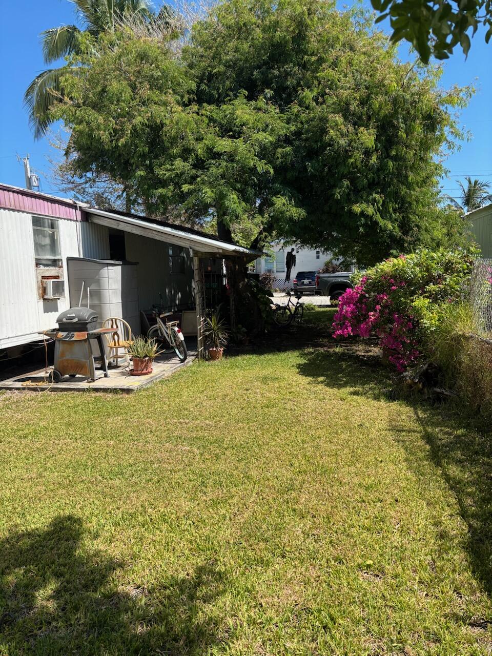A33 8th Avenue Key West, FL 33040 - Photo 7 of 13 a view of a patio with table and chairs under an umbrella