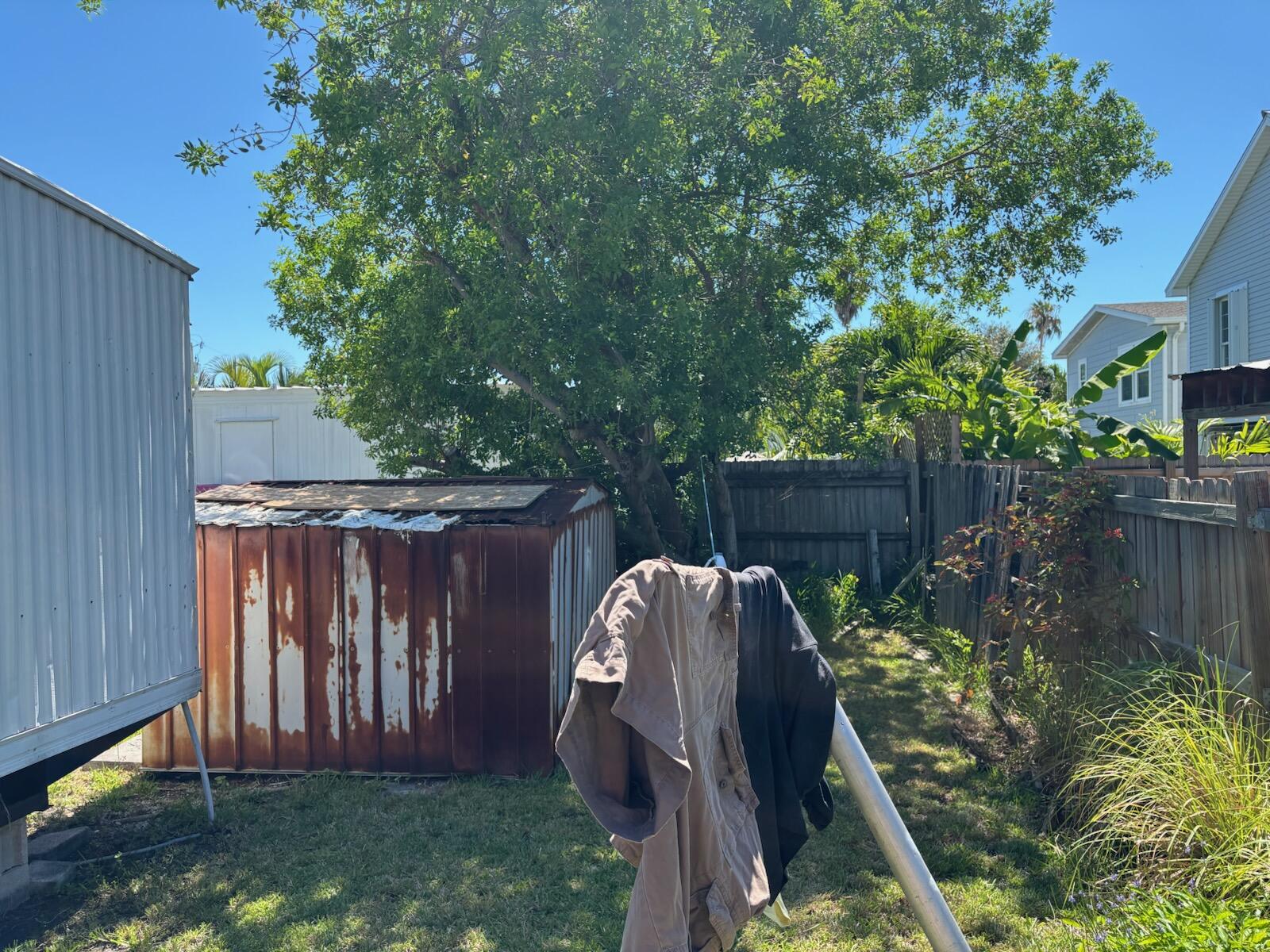 A33 8th Avenue Key West, FL 33040 - Photo 9 of 13 a view of a backyard with a fence and plants