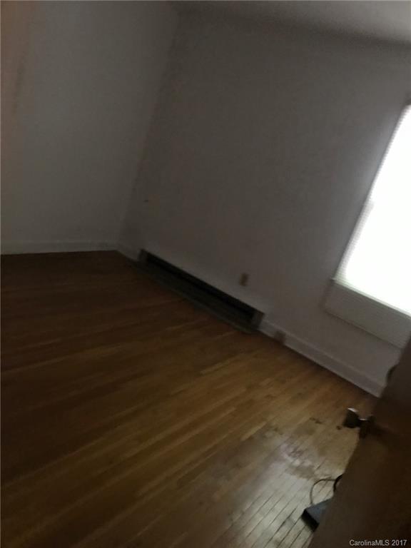 6221 Old Coach Road Charlotte, NC 28215 - Photo 9 of 9 a view of an empty room and wooden floor