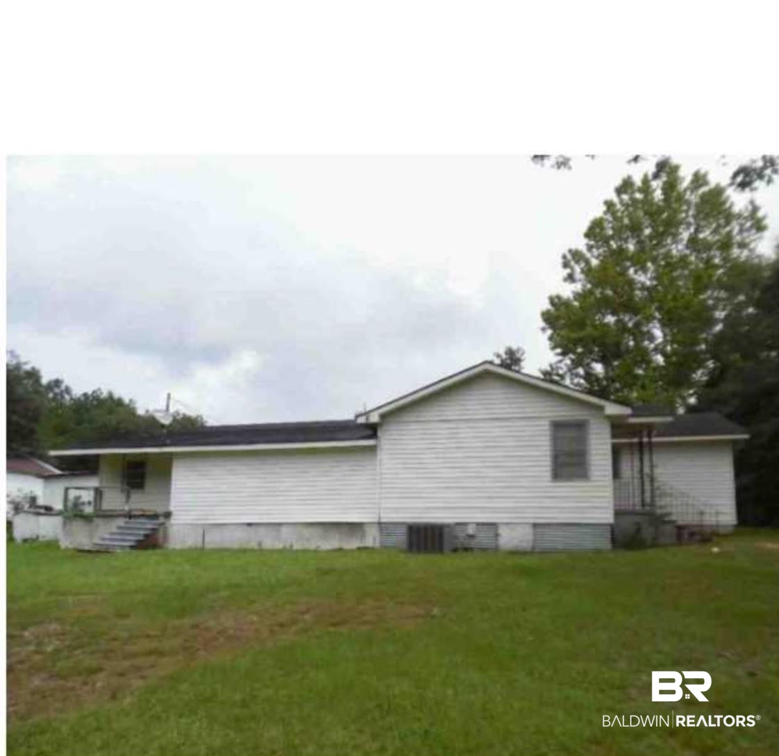 3850 Newman Road Mobile, AL 36695 - Photo 4 of 27 View of home's exterior with a lawn