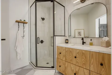 a bathroom with a sink and a mirror