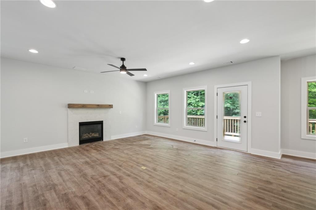 3131 Stonegate Drive Atlanta, GA 30331 - Photo 11 of 28 a view of an empty room with a window and wooden floor