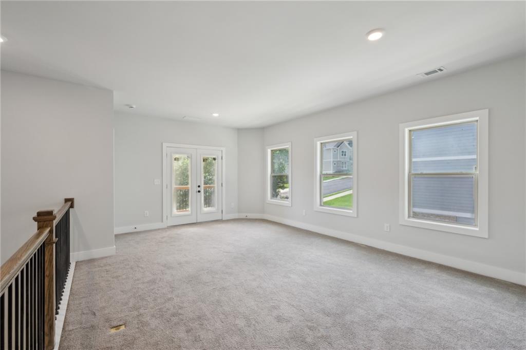 3131 Stonegate Drive Atlanta, GA 30331 - Photo 17 of 28 an empty room with windows