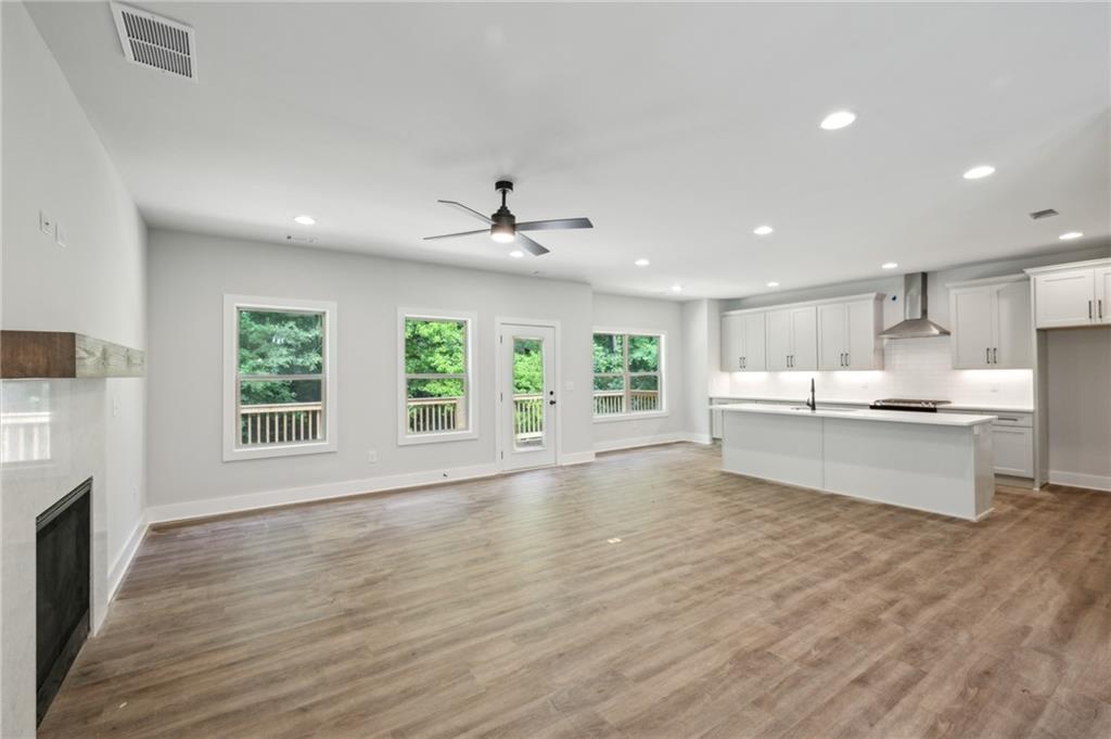 3131 Stonegate Drive Atlanta, GA 30331 - Photo 9 of 28 a large white kitchen with a large window and stainless steel appliances
