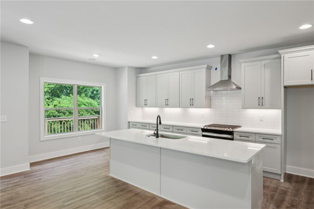 3131 Stonegate Drive Atlanta, GA 30331 - Photo 10 of 28 a kitchen with stainless steel appliances granite countertop a sink a stove and a refrigerator