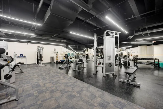 a view of parking garage with cars