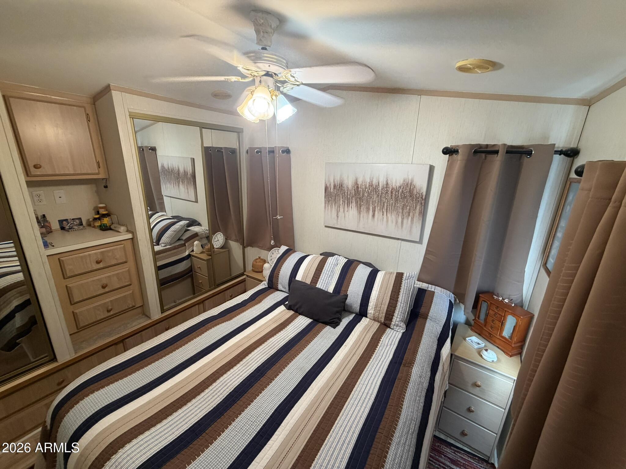 7750 East Broadway Road, Unit 707 Mesa, AZ 85208 - Photo 11 of 17 a view of a living room with furniture and a flat screen tv