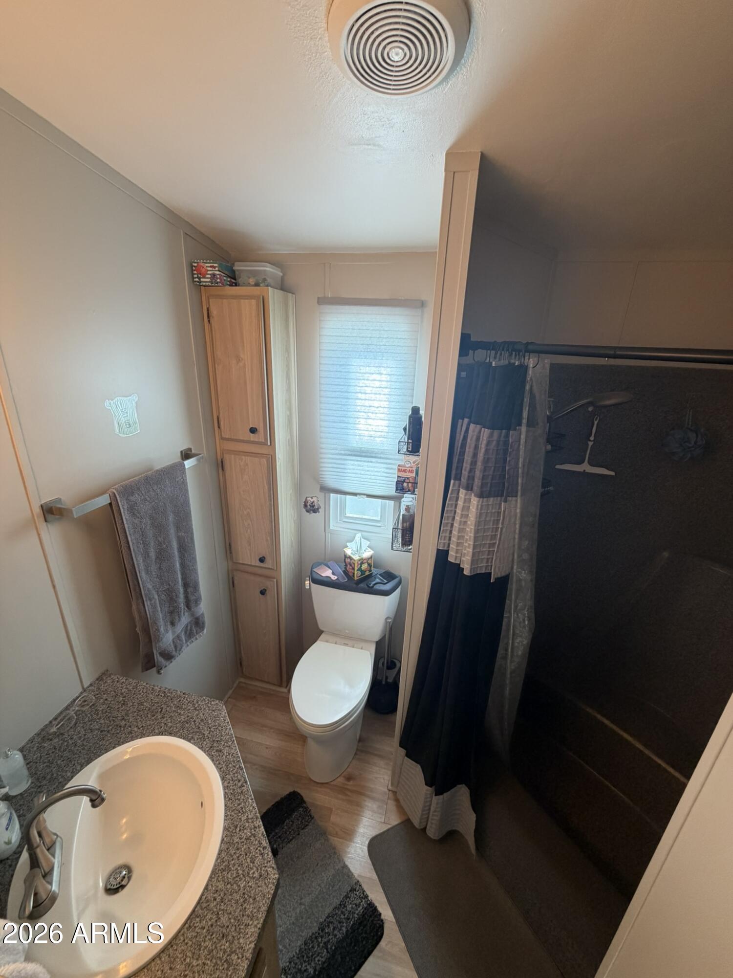 7750 East Broadway Road, Unit 707 Mesa, AZ 85208 - Photo 12 of 17 a bathroom with a sink and mirror