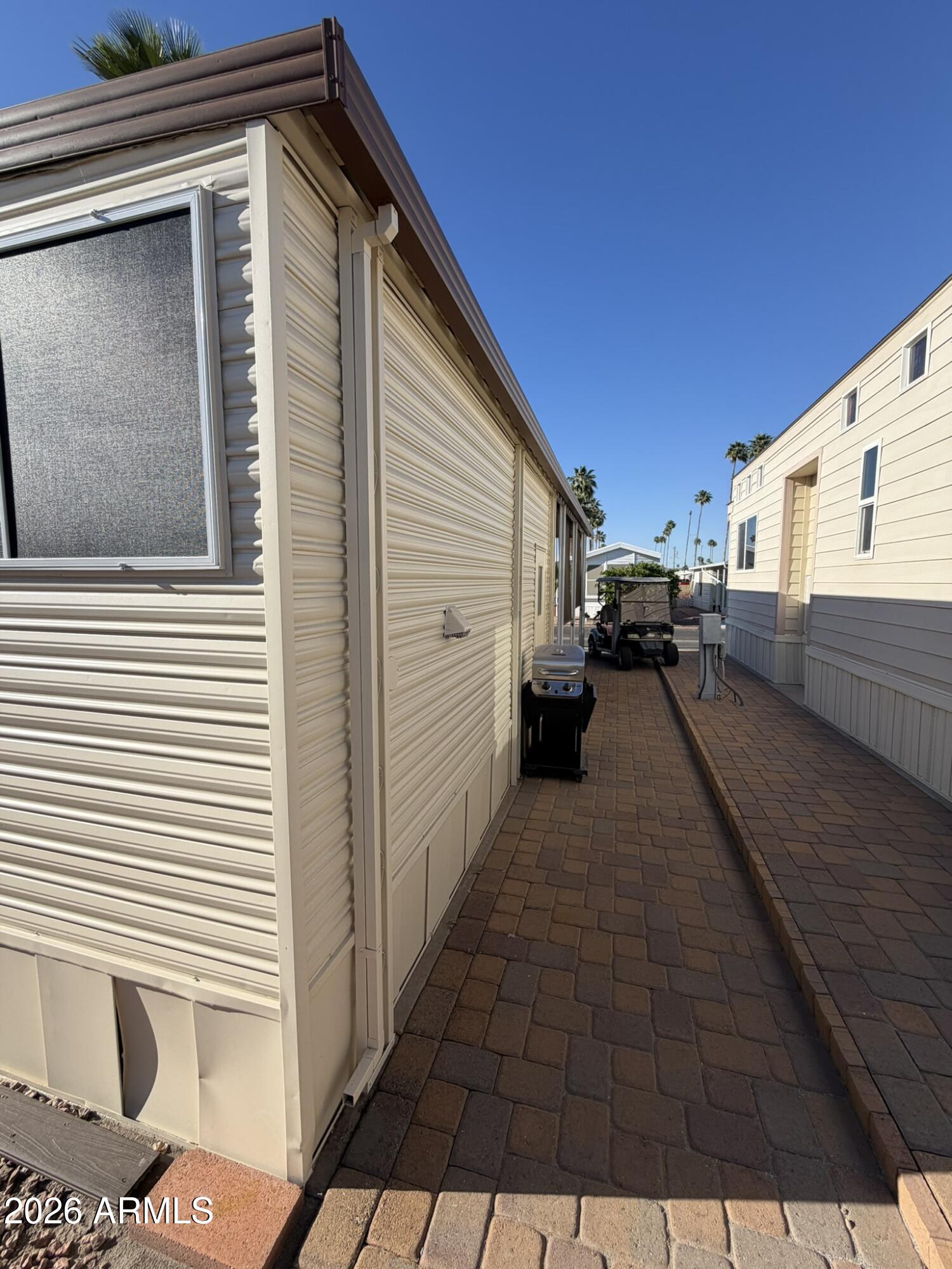 7750 East Broadway Road, Unit 707 Mesa, AZ 85208 - Photo 15 of 17 a view of a house with a barbeque