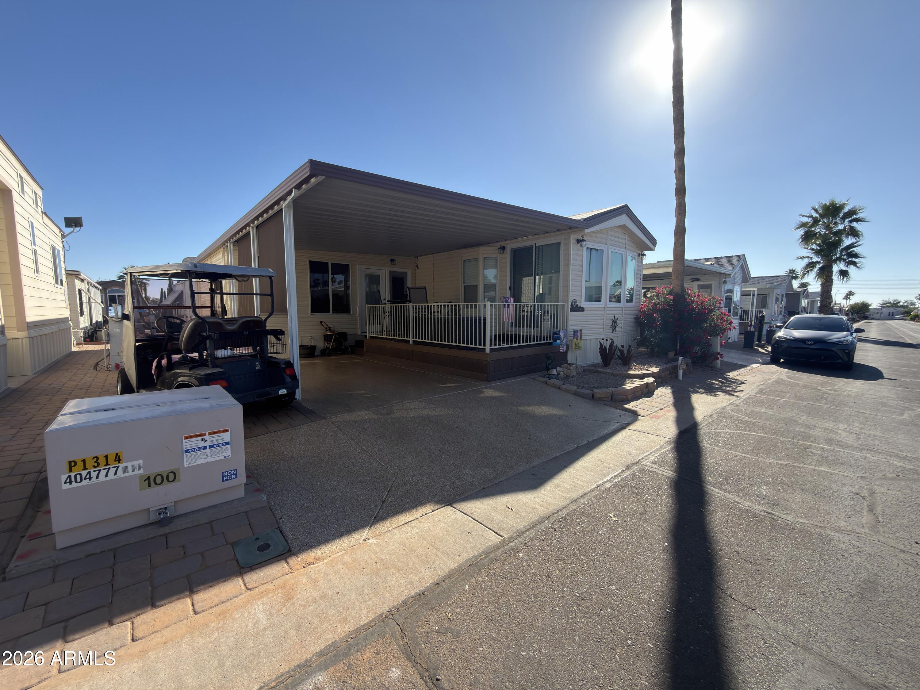 7750 East Broadway Road, Unit 707 Mesa, AZ 85208 - Photo 2 of 17 a car parked in front of house