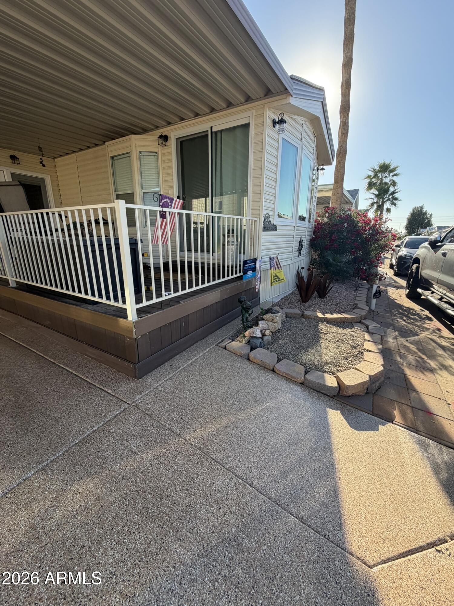 7750 East Broadway Road, Unit 707 Mesa, AZ 85208 - Photo 4 of 17 a view of a porch with furniture and garden