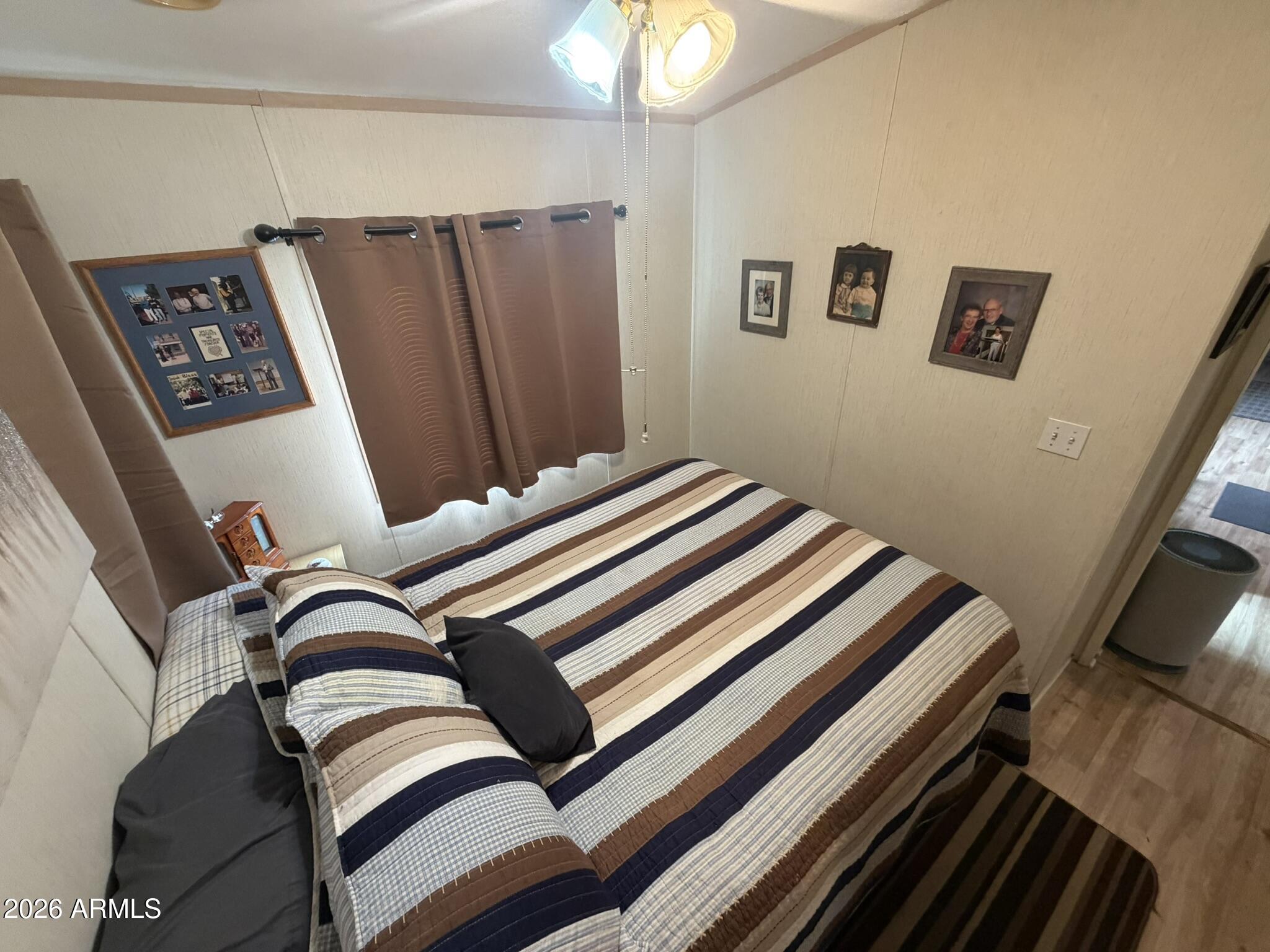 7750 East Broadway Road, Unit 707 Mesa, AZ 85208 - Photo 10 of 17 a view of bedroom with furniture