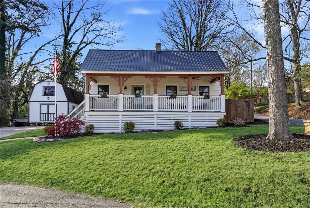 275 Strippling Street Ball Ground, GA 30107 - Photo 1 of 40 a view of a house with a yard