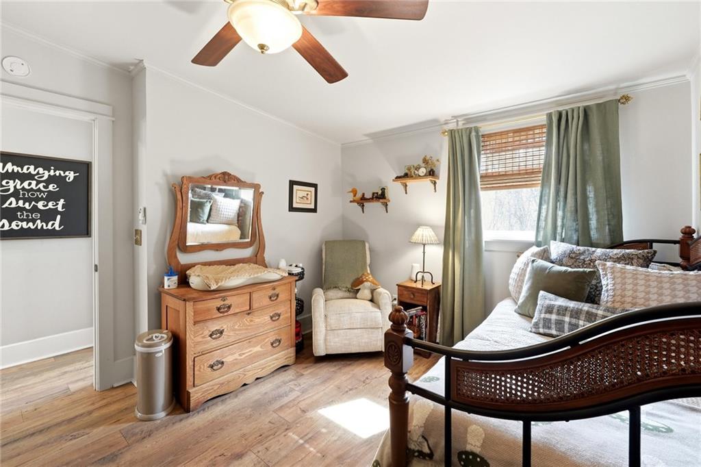 275 Strippling Street Ball Ground, GA 30107 - Photo 19 of 40 a living room with furniture and wooden floor