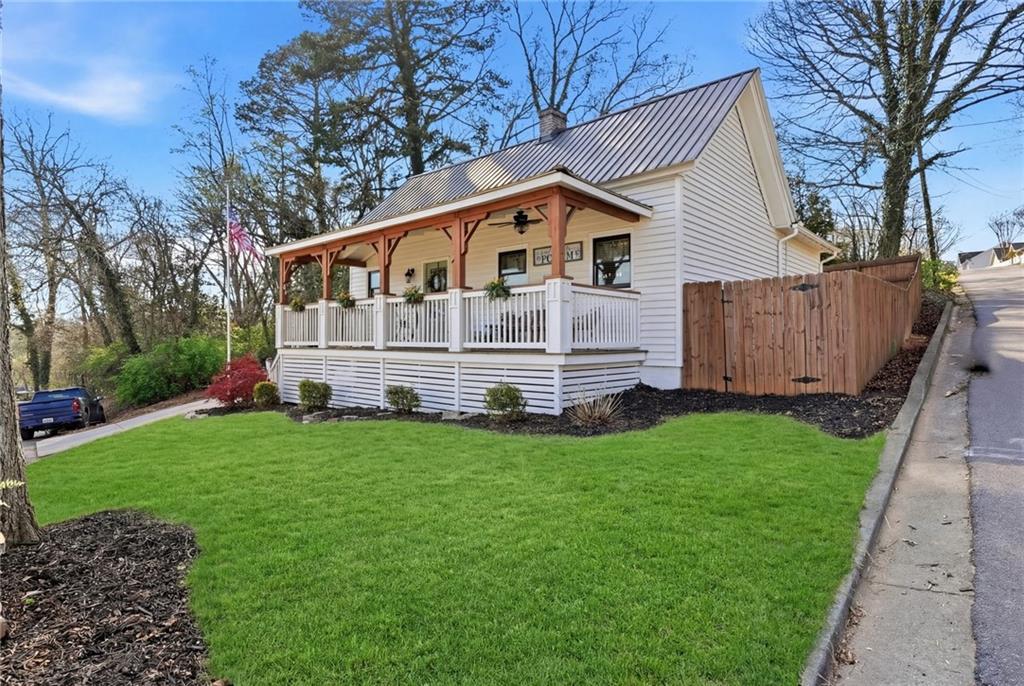 275 Strippling Street Ball Ground, GA 30107 - Photo 2 of 40 a view of a house with backyard
