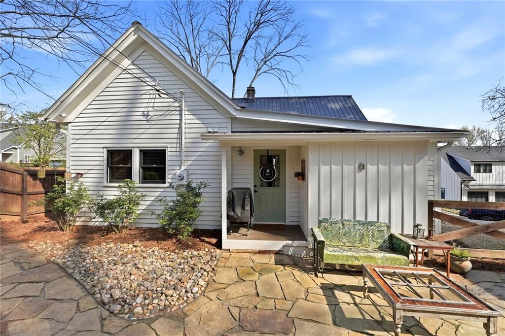 275 Strippling Street Ball Ground, GA 30107 - Photo 22 of 40 a backyard of a house with outdoor seating