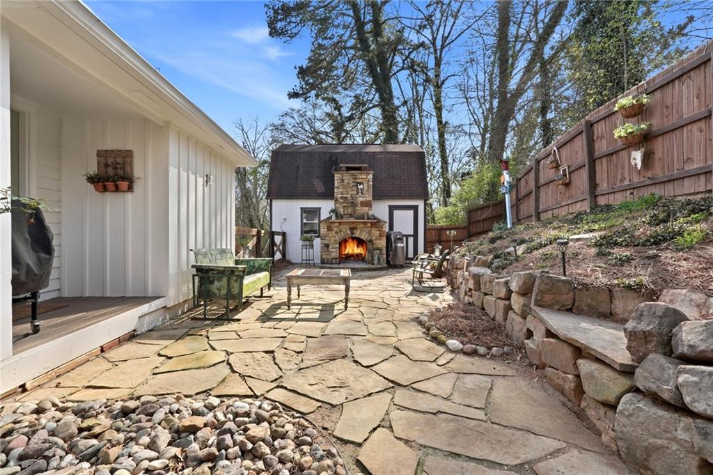 275 Strippling Street Ball Ground, GA 30107 - Photo 23 of 40 a view of a backyard with a sitting area